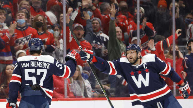 Jan 22, 2022; Washington, District of Columbia, USA; Washington Capitals left wing Alex Ovechkin (8) celebrates with Capitals defenseman Trevor van Riemsdyk (57) after a video review confirmed a goal against the Ottawa Senators during the third period at Capital One Arena. Mandatory Credit: Geoff Burke-USA TODAY Sports